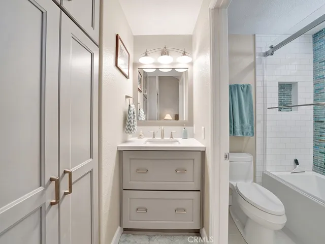 The ensuite guest bathroom is also fully remodeled with a Quartz upgraded vanity area, cabintery for storage and a beautiful shower.