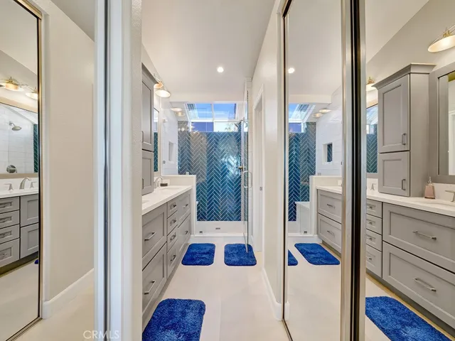 The primary ensuite bathroom is fully renovated and features two mirrored closets.