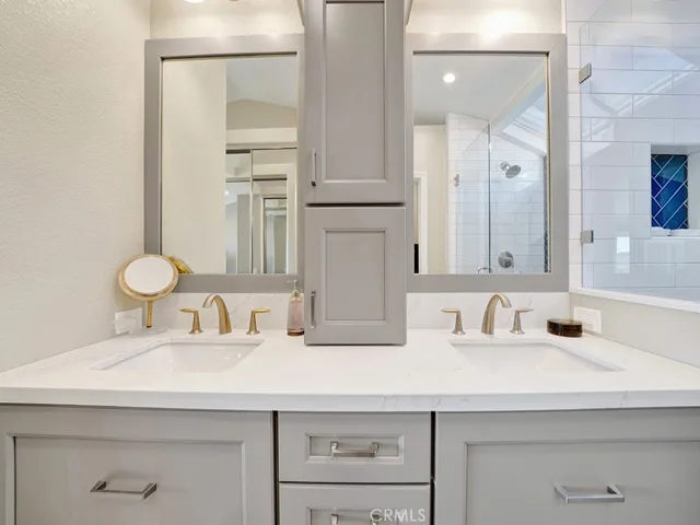 The ensuite primary bathroom has Quartz countertops, dual sinks, remodeled vanity and plenty of storage for all of your needs.
