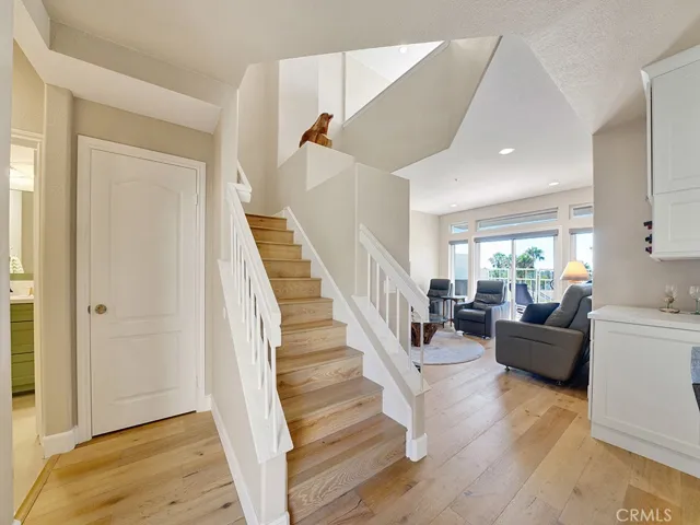 There are engineered wood floors found throughout the downstairs setup. The closet also has automatic light sensors.