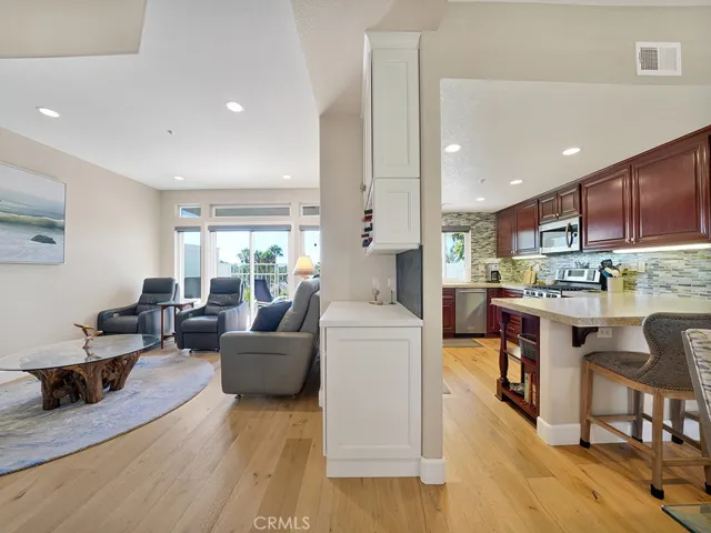 The downstairs layout is spacious, open and fully remodeled. There is also a mini wine bar/coffee area in the living room.
