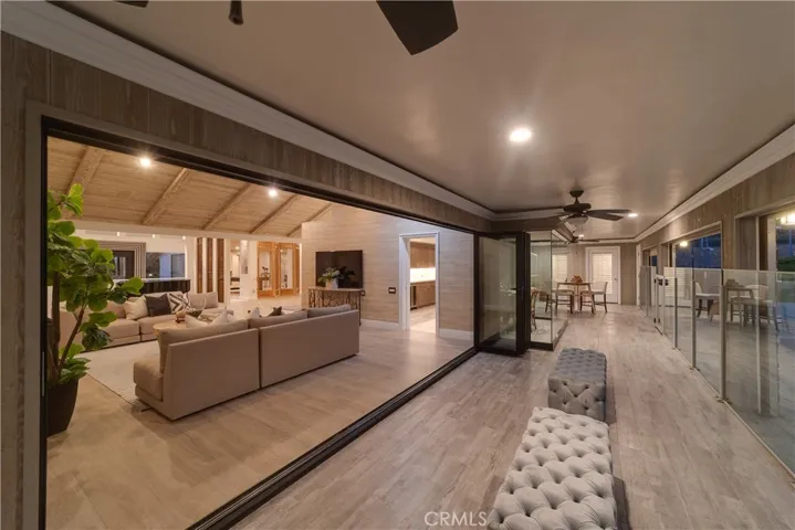 The patio door can be folded up, so the family room is connected to the patio.