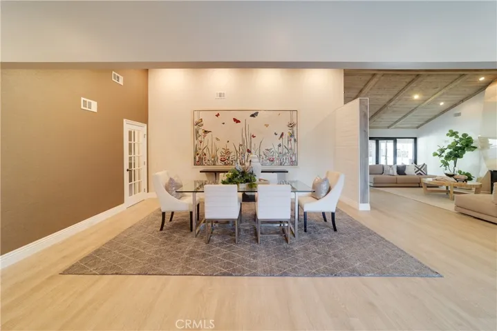 Formal dining with a wall mural.