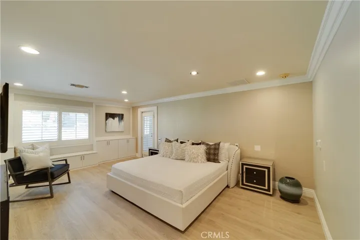 Primary suite with a door to the enclosed patio.