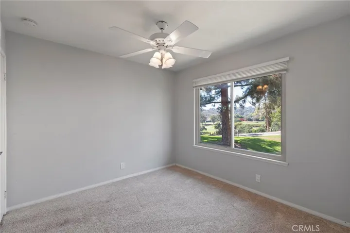 Secondary bedroom with greenbelt & golf course view.