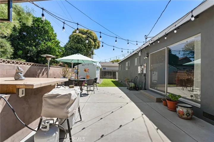 View of custom BBQ and backyard