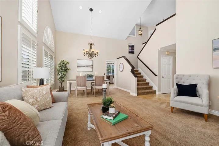 Ascend the staircase to access the upper level bedrooms.