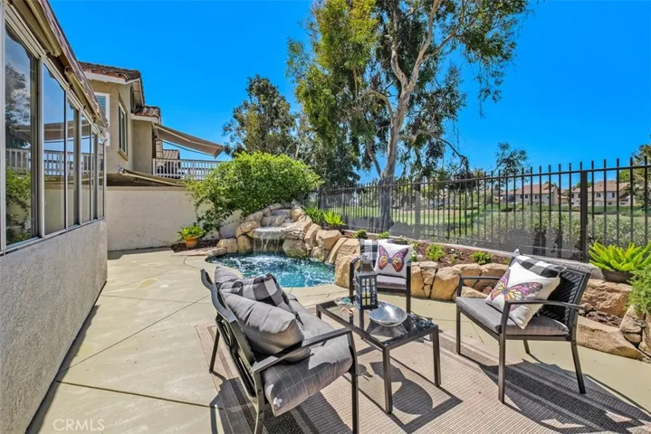 A retractable patio awning offers a cool spot to relax outside.