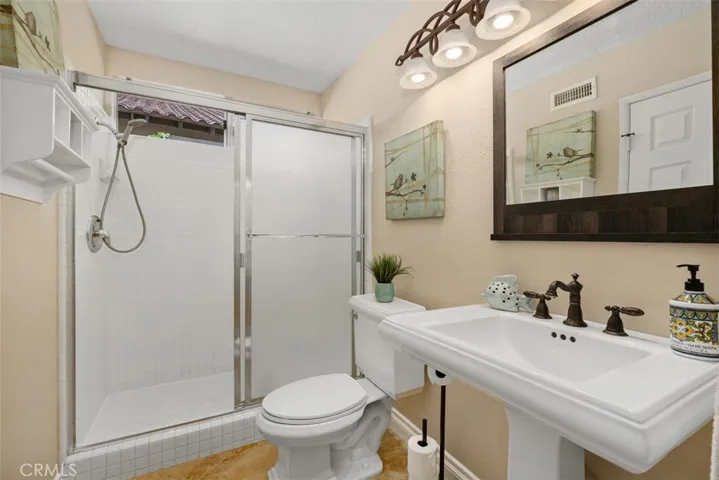 Main Floor Bathroom is complete with a walk-in shower.