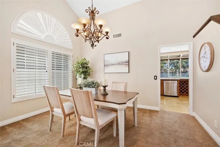 Neutral tones, abundant light, plantation shutters and fresh paint are some of the highlights of this dining space just off the kitchen.