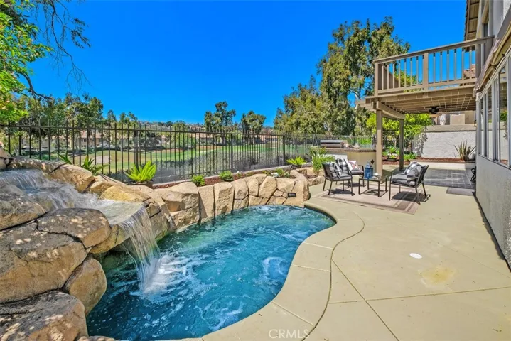 Large over sized spa with pebble tech pool finish offers a great way to cool down or warm up!