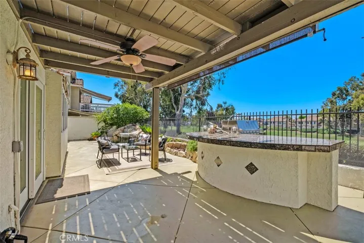 Spacious outdoor living space, complete with a covered patio, large BBQ island with views of the fairway and an oversized spa great for unwinding and relaxation.