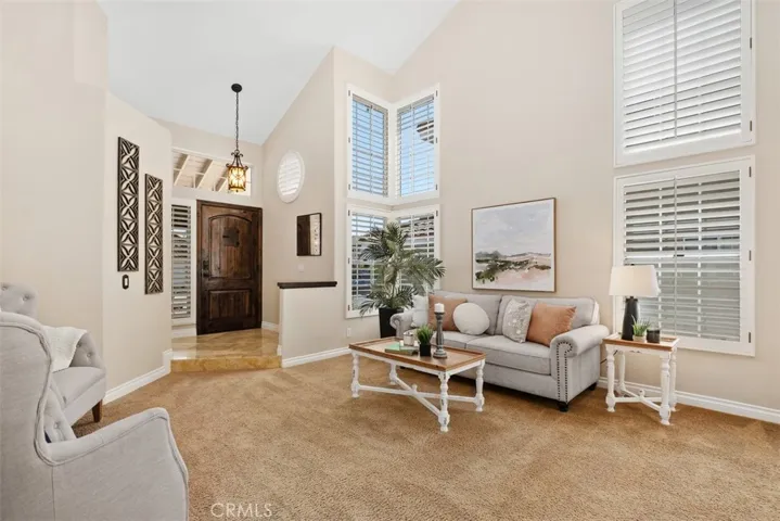 Custom light fixtures, shutters and the decorative rustic style door create a comfortable setting.