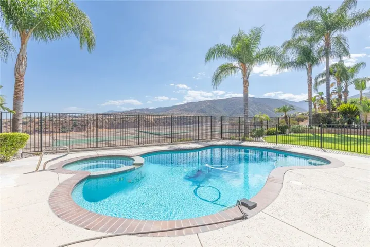 The sparkling pool and stunning views of the surrounding hills, offers a serene and picturesque backdrop.