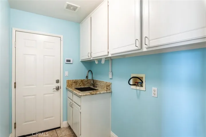 Laundry room includes a sink