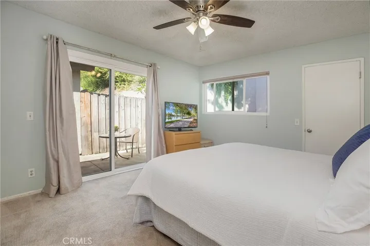 Primary suite with slider to patio.