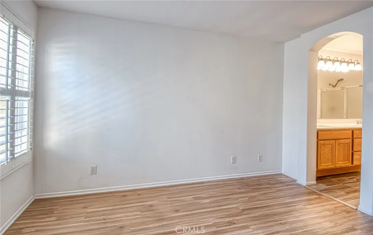 Primary bedroom opens to primary  bathroom.