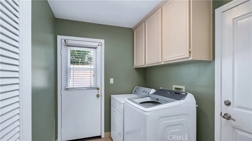 Full size laundry room gives you an entrance to the garage.