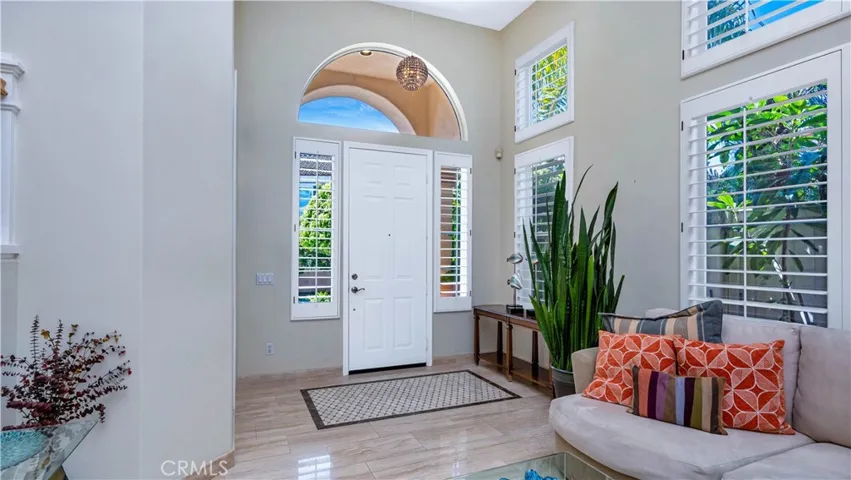Arched door entry. Custom inlaid tile "rug" You won't trip on this!