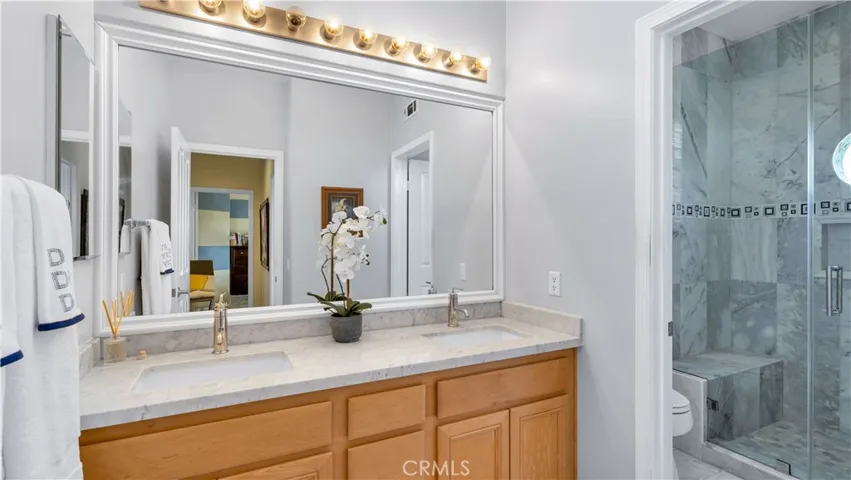 Hall bathroom has been completely redone with 2 sinks, Hollywood lighting and quartz countertops.