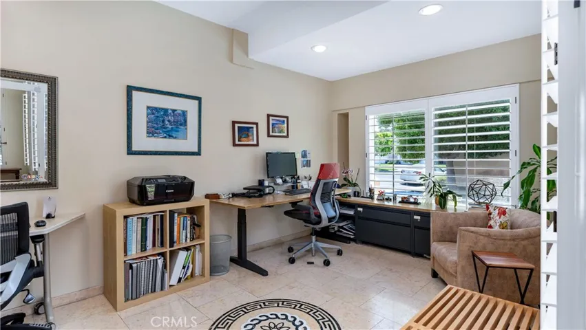 Downstairs office has travertine floors and plenty of room for all your work needs .Can easily be converted to first floor bedroom.