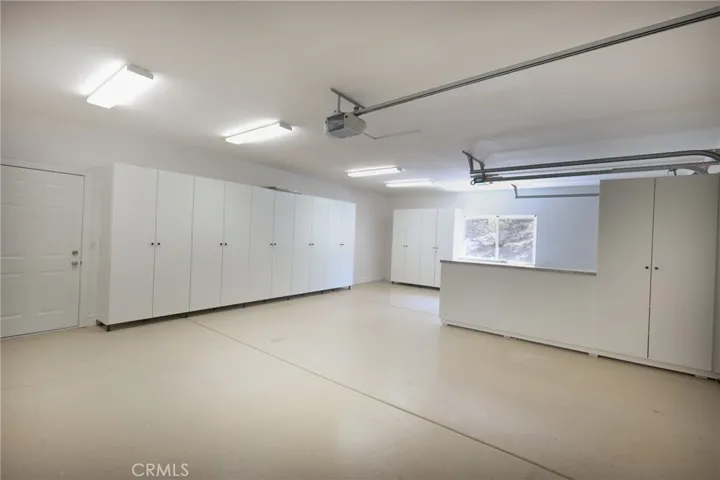 Abundant Cabinets in Garage & Epoxy Floors