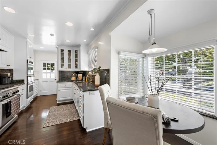 Gourmet kitchen with breakfast nook granite countertops, Sub Zero refrigerator, Thermador oven, warming drawer & more
