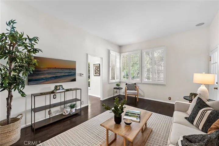 Inviting family room with wet bar overlooking rear pool & spa
