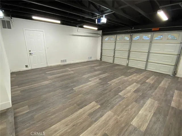 Garage with the side door to the side yard.