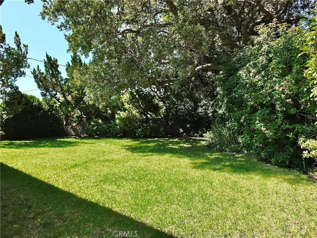 secluded serene backyard perfect for entertaining with a adequate sized side yard
