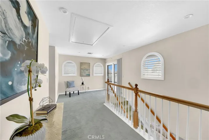 Upstairs loft area with access to private balcony