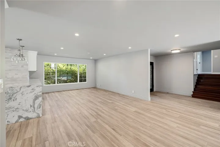 Dining - Entry - Stairs to Upper Level w/ Family Room, Private Primary & Newly Remodeled Bathroom