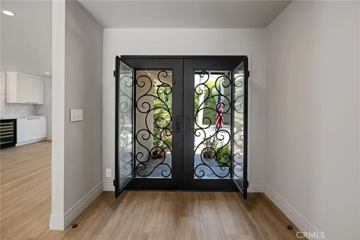 Custom Iron doors - glass panels open to allow an amazing breeze.