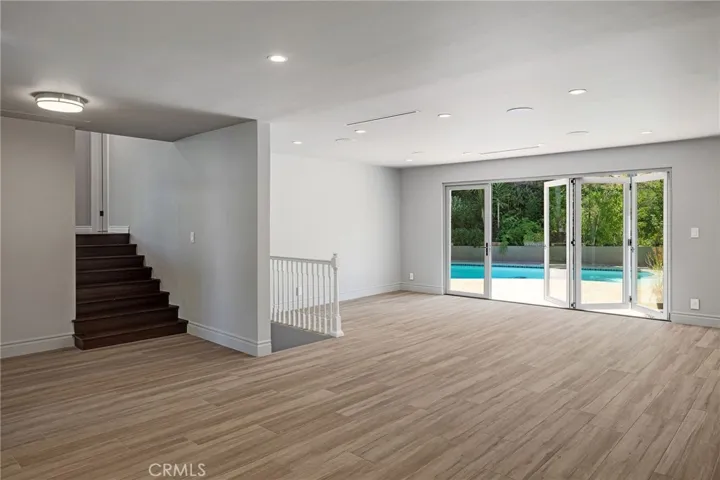 View from Dining/Kitchen - Into Living Room with doors to backyard