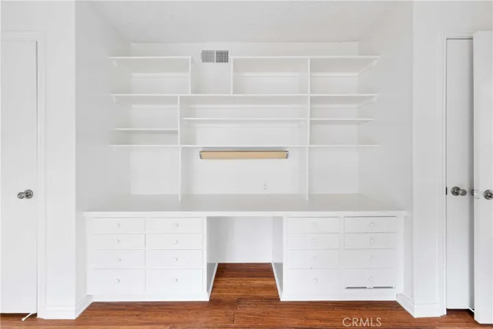 Great built ins for student desk or in home office with closets at each end