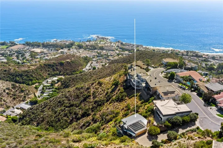  A long paver-finished driveway with ample parking enhances the feeling of privacy at the residence, which elevates sophistication on a homesite spanning nearly 8,432 square feet.