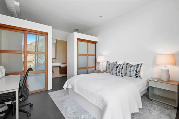  A bedroom on the main level, a security system with cameras, and solar power are featured.