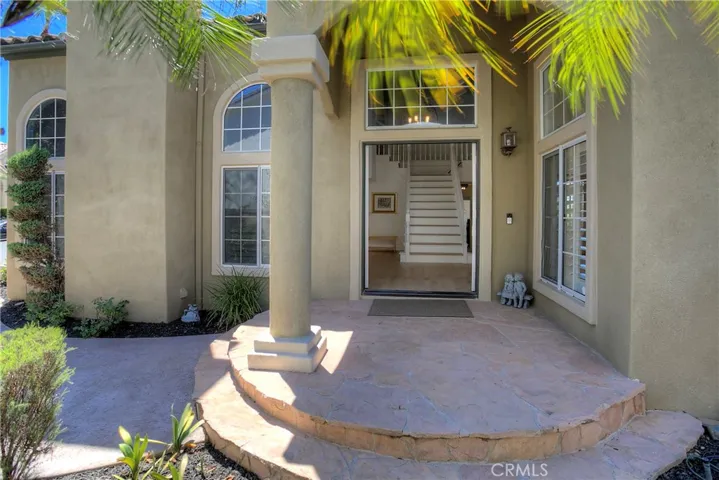 Drought-sensitive landscaping beautify the entrance to the home.