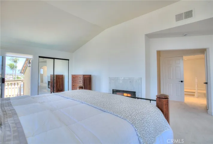 Upstairs, you will find a large primary suite with a retreat area, two closets (including a walk-in closet) and a private balcony