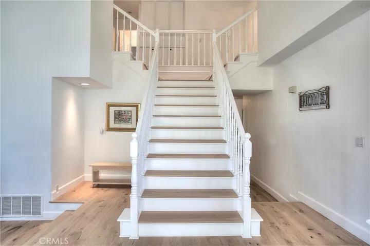 Staircase adds a charming feel as you enter the home