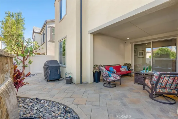 View facing the outdoor sitting area and slldiing glass door entrance.