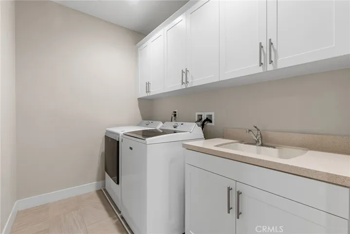 The laundry room is conveniently located upstairs.