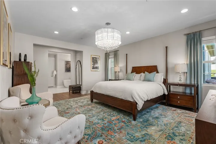 View from the other side of the master bedroom suite facing the attached bathroom.