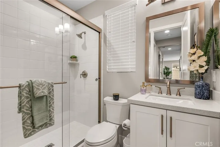 Downstairs bathroom features a walkin shower.