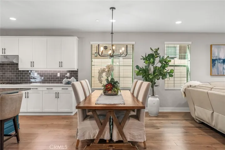 Facing the dining table. The kitchen is on the left and living area is on the right.