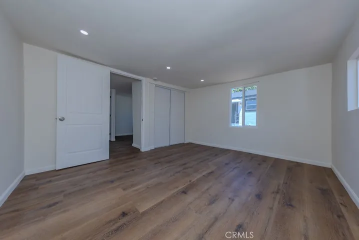 Primary Bedroom Paneled Door and Closet