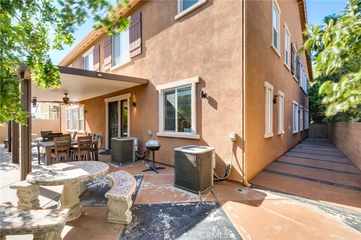 Back yard with cover patio and cemented round table for entertainment