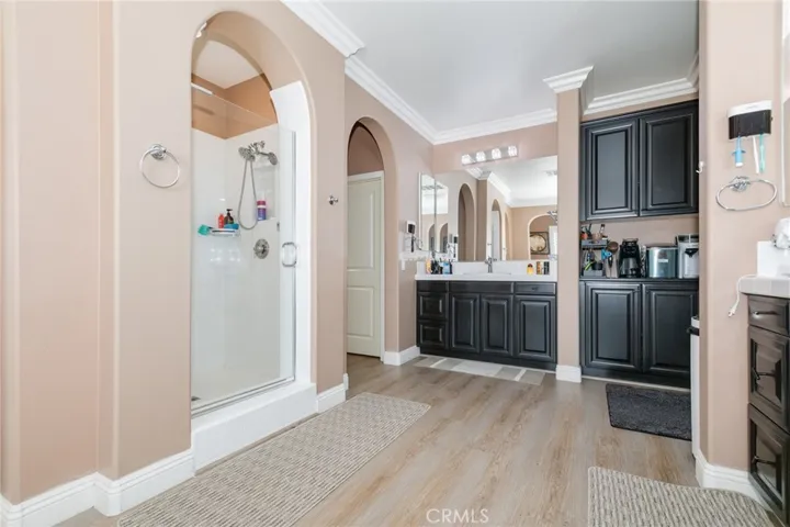 Main bedroom: private toilet, crown molding, vanity fixture