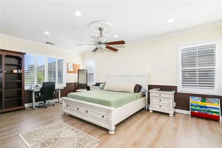 Main bedroom: Lots of windows, recess lighting and ceiling fan