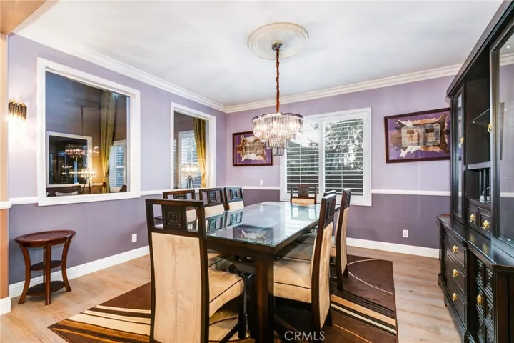 Luv tile flooring with glass windows to look into the formal living room and entrance door